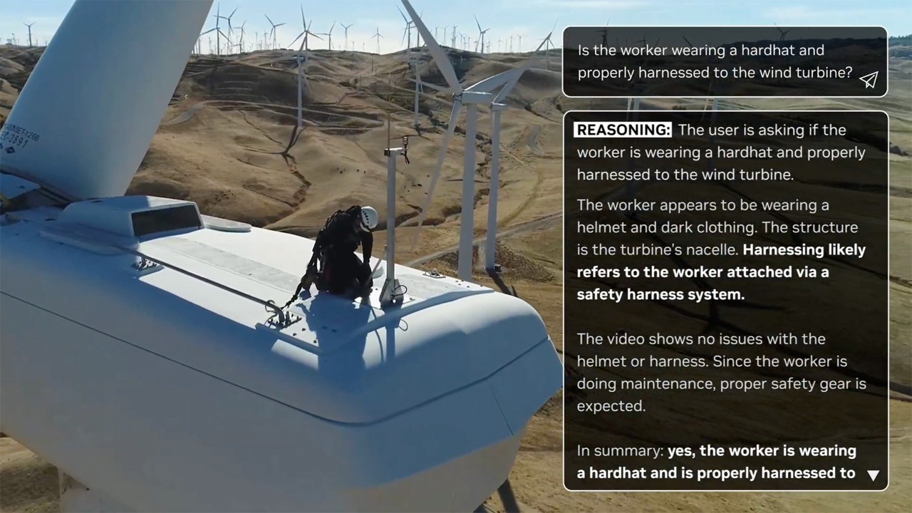 Worker in safety gear maintaining wind turbine