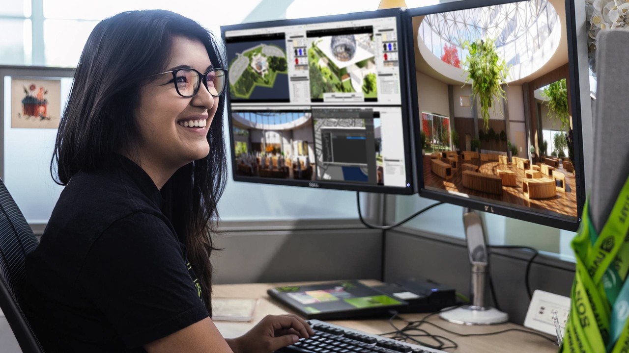 A developer is learning AI foundational skills on her desktop monitor 