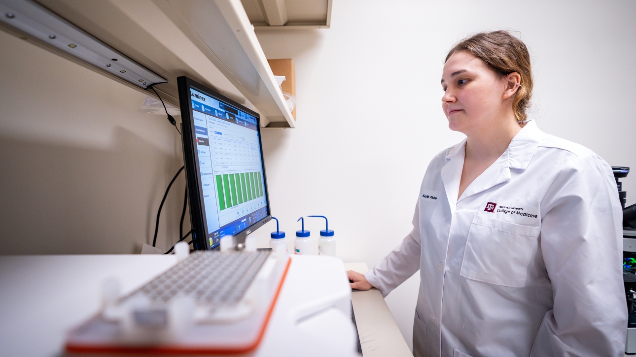 Texas A&M College of Medicine researcher at workstation