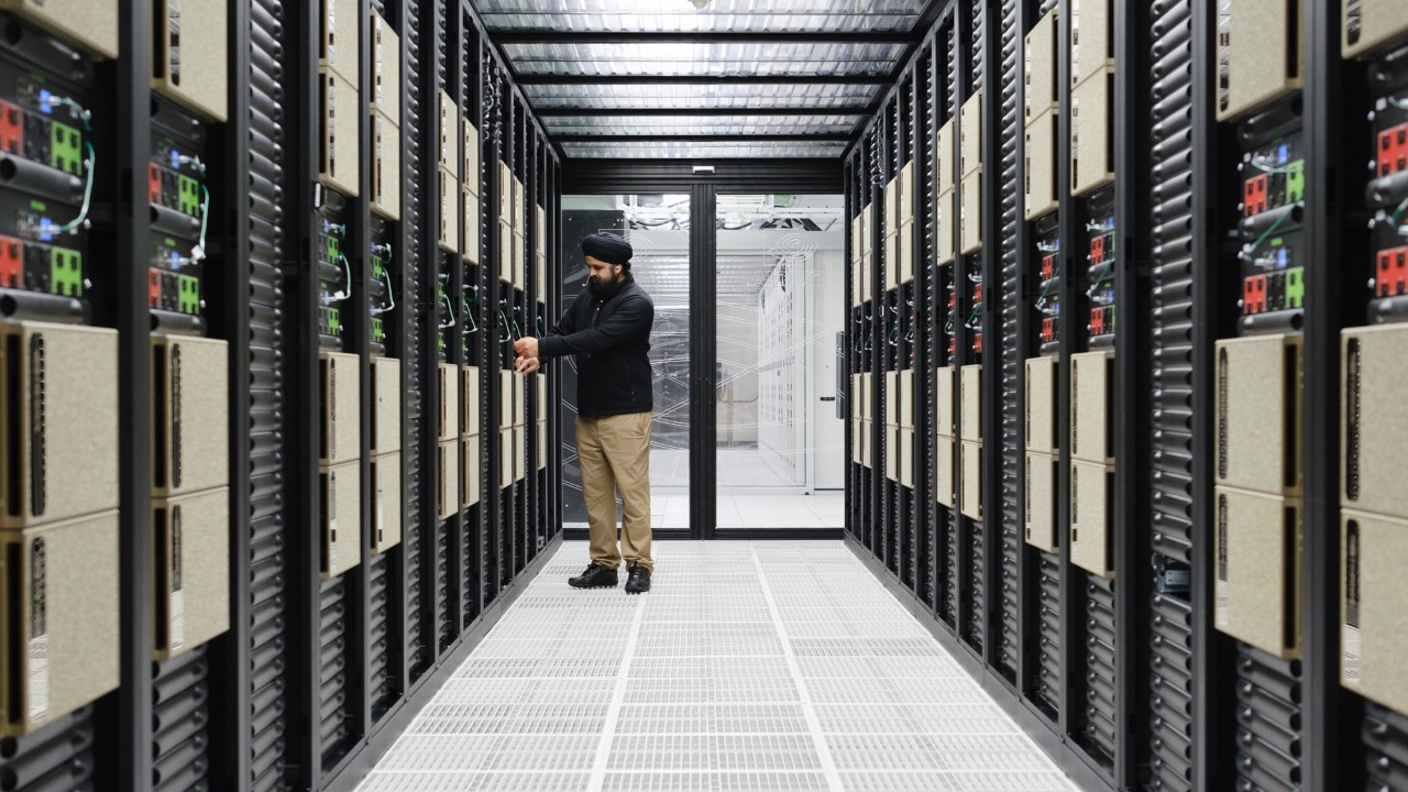 Person standing in a server room